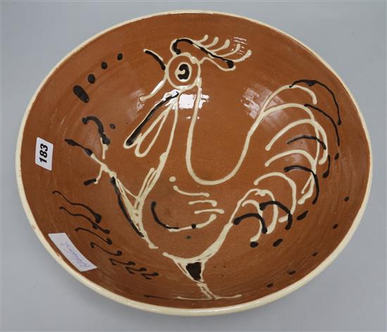 A 1950s cockerel decorated pottery bowl